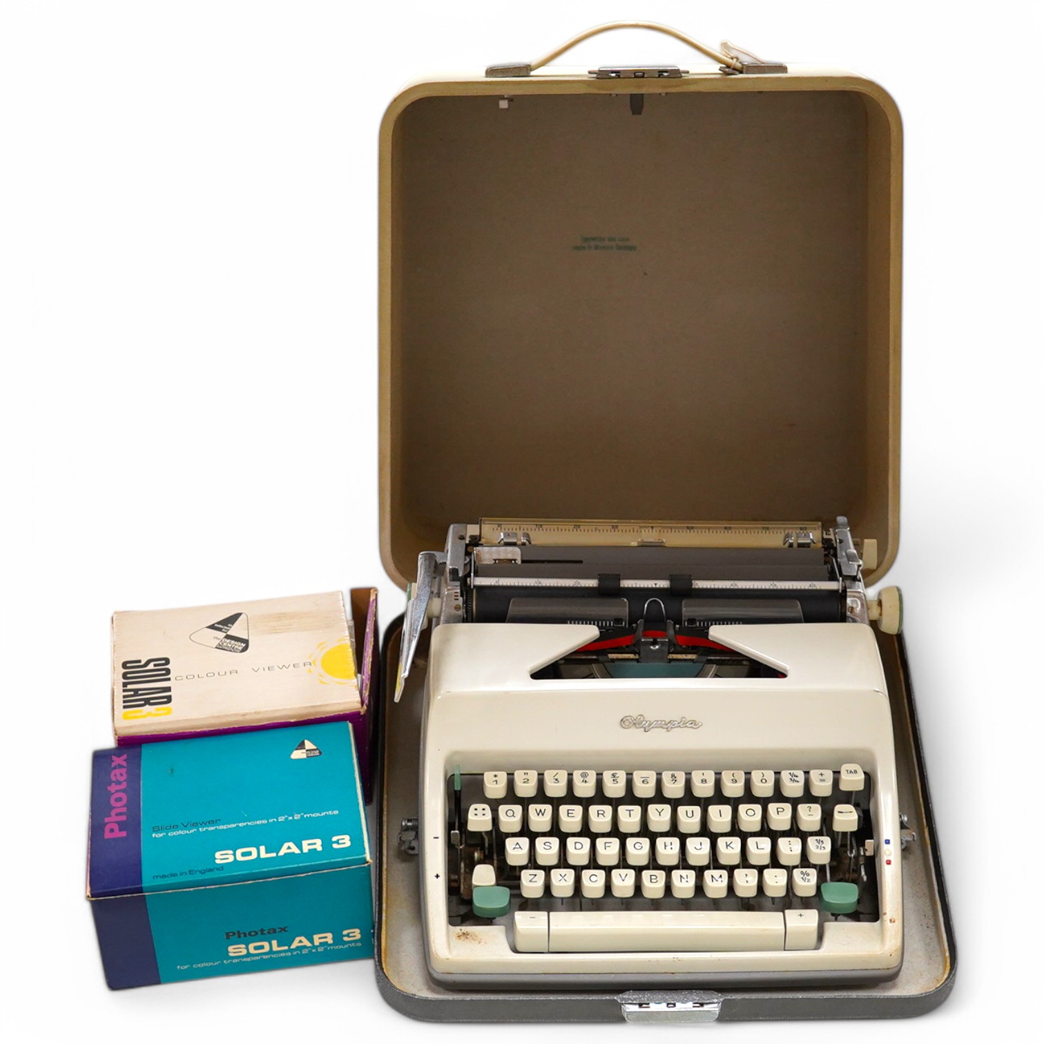 An Olympia typewriter and two 1960s slide viewers, typewriter 37cm x 35cm. Condition - untested if in working order.